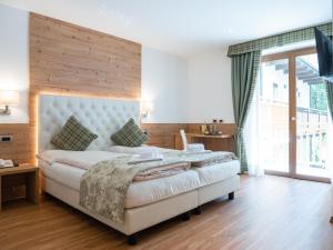 Posteľ alebo postele v izbe v ubytovaní Hotel Almazzago