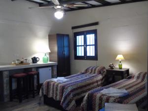 En eller flere senge i et værelse på Abuela Faustina