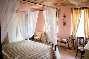 Postel nebo postele na pokoji v ubytování Agriturismo Monbertola