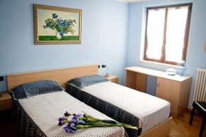 Postel nebo postele na pokoji v ubytování Agriturismo Monbertola