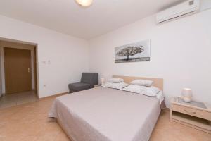 Postel nebo postele na pokoji v ubytování Seaview Center House Brela