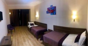 Ліжко або ліжка в номері Non-stop hotel