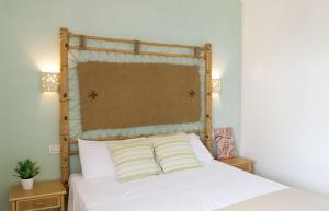Postel nebo postele na pokoji v ubytování Residence Borgo Latino- Localo