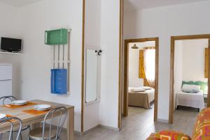 Postel nebo postele na pokoji v ubytování Residence Borgo Latino- Localo