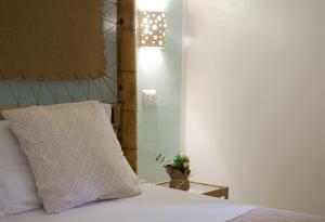 Postel nebo postele na pokoji v ubytování Residence Borgo Latino- Localo