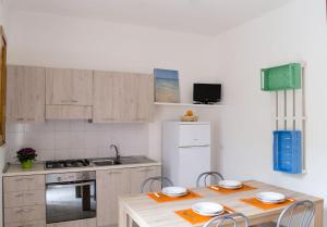 Kuchyň nebo kuchyňský kout v ubytování Residence Borgo Latino- Localo