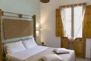 A bed or beds in a room at Residence Borgo Latino- Localo