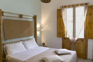 Postel nebo postele na pokoji v ubytování Residence Borgo Latino- Localo