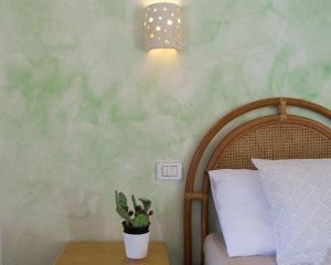 Postel nebo postele na pokoji v ubytování Residence Borgo Latino- Localo
