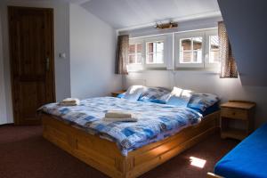 Postel nebo postele na pokoji v ubytování Horský Penzion Černava