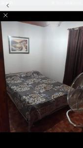 Ένα ή περισσότερα κρεβάτια σε δωμάτιο στο TOMI