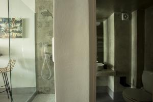 a bathroom with a shower and a toilet in it at Urban Living 2 in Thessaloniki