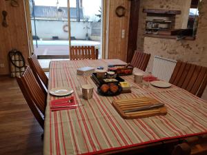 a table with a plate of food on it at La Hautée des Francs in Veigné