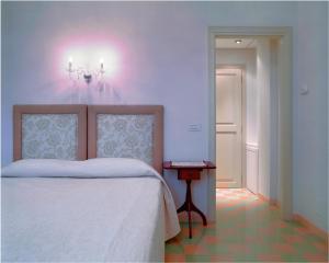 Postel nebo postele na pokoji v ubytování Roccafiore Wine Resort & Spa