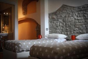 Postel nebo postele na pokoji v ubytování B&B Le Streghe
