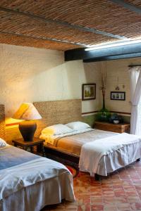 Säng eller sängar i ett rum på Las Palomas Bed & Breakfast (16 y Mayores)