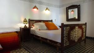 Postel nebo postele na pokoji v ubytování Riad Razane Fez