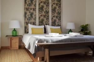 Cama ou camas em um quarto em Villa Margaridi