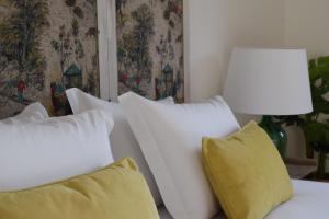 Cama ou camas em um quarto em Villa Margaridi