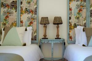 Cama ou camas em um quarto em Villa Margaridi