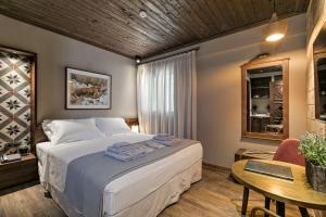 Posteľ alebo postele v izbe v ubytovaní Estia Boutique Apartments