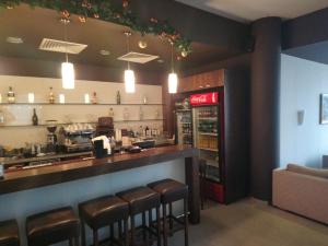 a bar in a restaurant with a coca cola machine at Studio L006 in Aspen Golf in Bansko