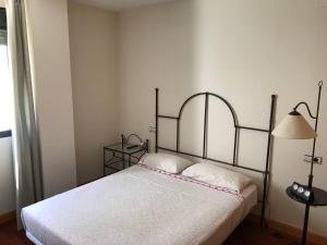 Postel nebo postele na pokoji v ubytování Villa de Madrid 17
