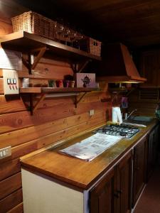 a kitchen with a counter with a stove top at Casetta Chamois in Chamois