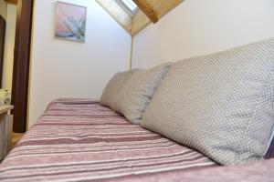Postel nebo postele na pokoji v ubytování Apartmani Miščević