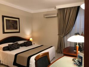 Posteľ alebo postele v izbe v ubytovaní Massimo Plaza Hotel