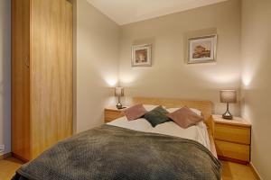 Posteľ alebo postele v izbe v ubytovaní Rubin Apartamenty Mozaika centrum taras