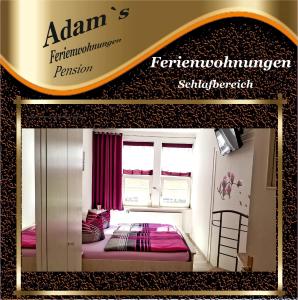 a sign for a bedroom with a bed in a room at Adams Pension und Ferienwohnungen in Mühlhausen +20 photos