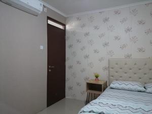 Postel nebo postele na pokoji v ubytování Gateway Pasteur 2 BR tower depan Jade 11 C