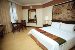 Postel nebo postele na pokoji v ubytování Wiang Inn Hotel