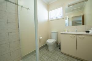a bathroom with a toilet and a sink and a shower at Yarra Gables in Healesville