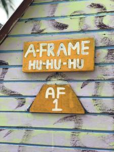 a sign on the side of a building with the words fame hue two at Beach Shack Chalet - Garden View Aframe Big Unit in Tioman Island