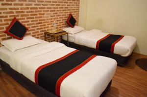 Uma cama ou camas num quarto em Newa Home