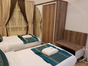 Postel nebo postele na pokoji v ubytování Orient Apartments