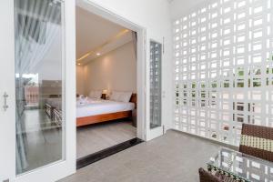 Postel nebo postele na pokoji v ubytování Chi Thanh Villa
