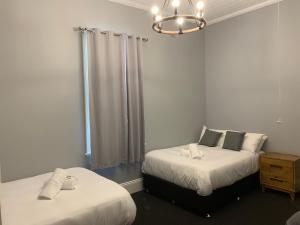 Postel nebo postele na pokoji v ubytování Abermain Hotel