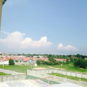 a view of a park with houses and a field at J&E in Nong Prue