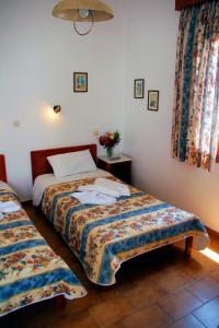 Ένα ή περισσότερα κρεβάτια σε δωμάτιο στο Rubini Rooms