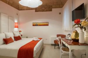 A bed or beds in a room at Amatè Suite