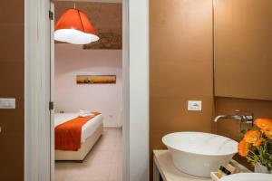 A bed or beds in a room at Amatè Suite