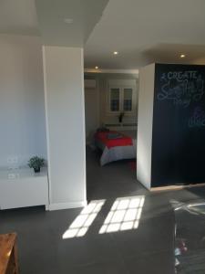 a bedroom with a bed with a red blanket at WindRose 0 in Madrid