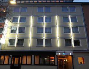 
a large white building with a window in it at City Hotel by celina in Hagen
