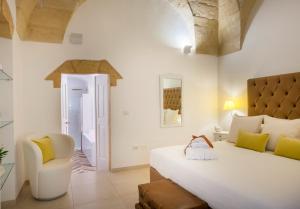 A bed or beds in a room at Amatè Suite
