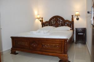 Кровать или кровати в номере Hotel Green Prundi
