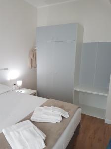 Postel nebo postele na pokoji v ubytování Affittacamere Risorgimento