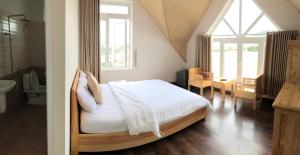 Postel nebo postele na pokoji v ubytování Spring Hotel